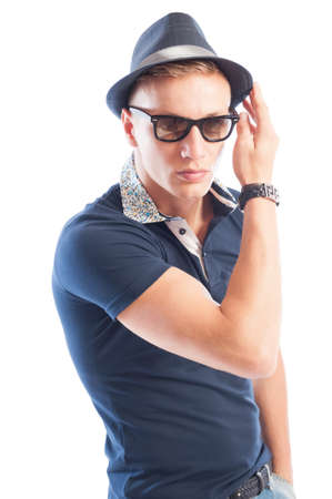 Blond fashion male model wearing blue t-shirt, hat and sunglassesの写真素材