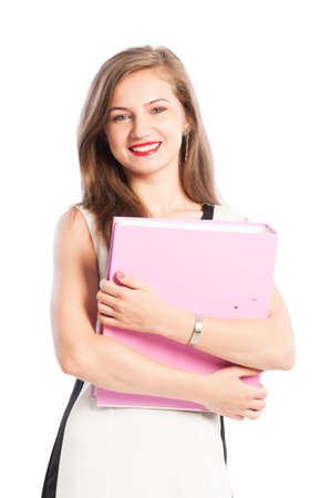 Smiling business woman holding portolio with both handsの写真素材
