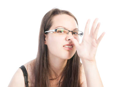 Young natural teen making funny face using hand and nose