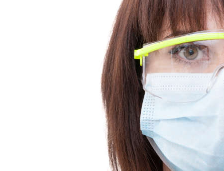 Half face of a dentist woman wearing protection glasses with copy space on the leftの写真素材