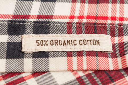 Organic cotton textile label on checkered shirtの写真素材