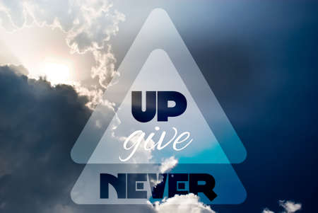Never give up concept quote on blue sky backgroundの写真素材