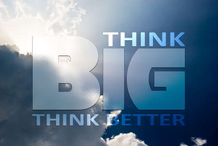 Think big and better concept quote text written on blue skyの写真素材