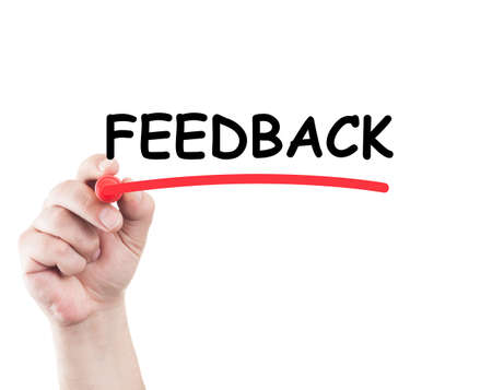 Hand underlining feedback word with marker on transparent glass and white background with copy spaceの写真素材
