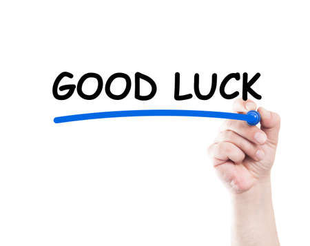 Good luck text written underlined on transparent screen with marker held by handの写真素材