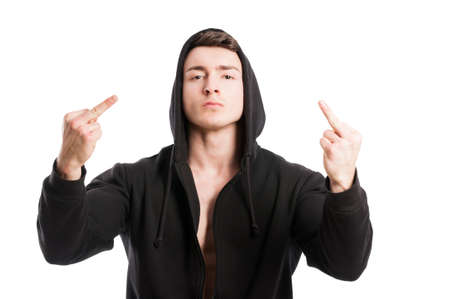 Badboy showing middle fingers wearing a black hoodie on white backgroundの写真素材