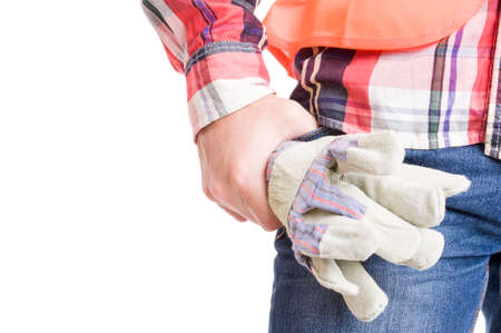Builder hand holding construction gloves on white copy spaceの写真素材