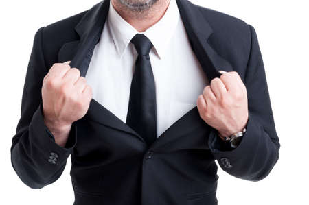 Powerfull and strong  business man pulling or ripping suit jacket as a superheroの写真素材