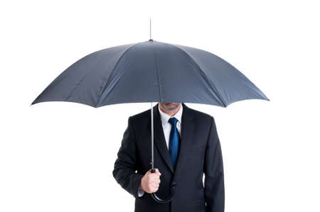 Anonymus business man with an open umbrella. Protection or insurance from financial risk conceptの写真素材