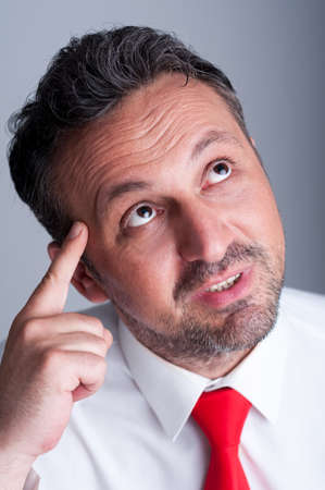 Pensive business person having an idea. Executive manager thinkingの写真素材