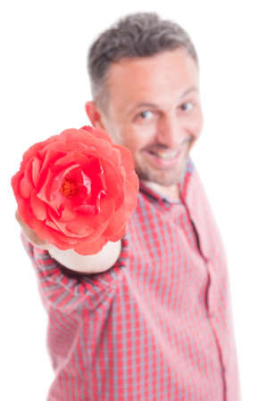Romantic male offering flower. Lover concept isolated on white backgroundの写真素材