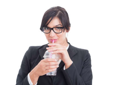 Business woman drinking water with straw on her breakの写真素材