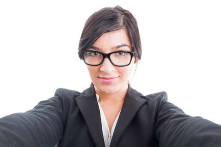Business woman taking a front selfie concept isolated on white backgroundの写真素材