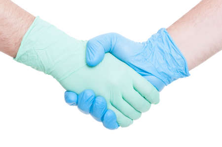 Doctors handshake as partnership or teamwork Medical team hand shake as success conceptの写真素材