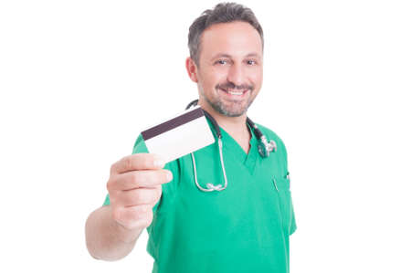 Pay secure using credit card for medical services. Doctor holding creditcard
