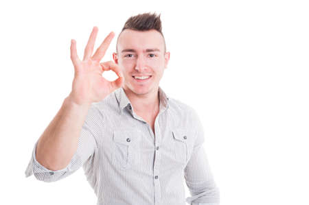Smiling man showing perfect or good sign gesture isolated on white