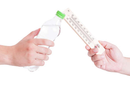 Summer heat exchage between thermometer and bottle of cold water isolated on white