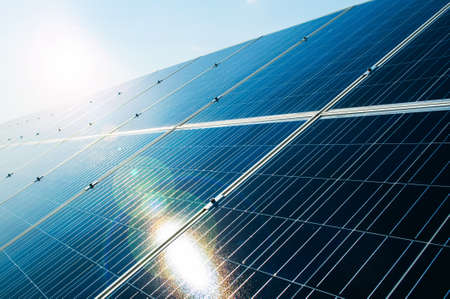 Sunray reflecting on solar power photovoltaic panel as green and renewable electric energy solution...