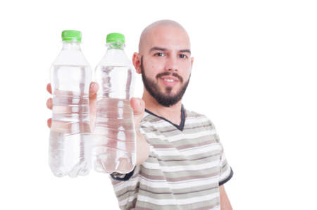 Happy man holding two bottles of cold water as hydration in summer heat conceptの写真素材