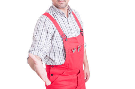 Anonymous mechanic or plumber offering handshake isolated on white