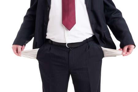Broke or poor businessman, accountant and financial manager showing empty pants pockets as bankrupt conceptの写真素材