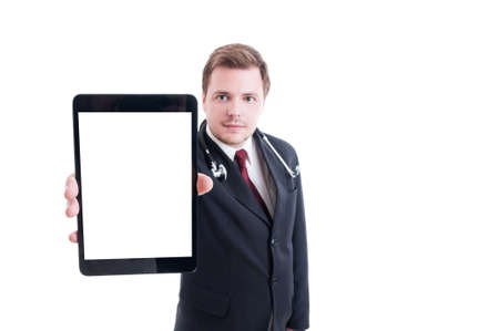 Medic or doctor showing tablet with empty white screen display as copy spaceの写真素材