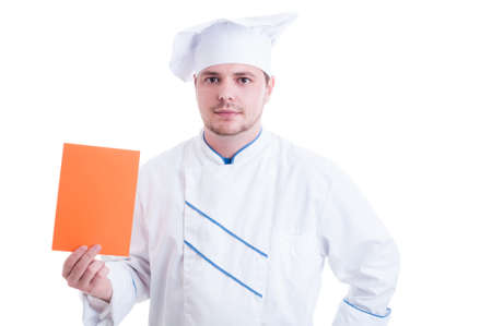Chef or cook holding orange paper card with blank advertising copy spaceの写真素材