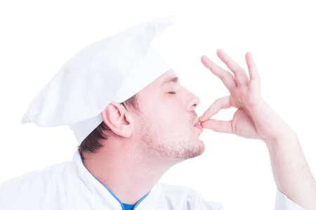 Side face of chef or cook making tasty delicious gesture by kissing fingers isolated on whiteの写真素材