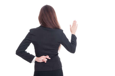 Fake oath made by dishonest woman lawyer or witness behind her back isolated on white backgroundの写真素材
