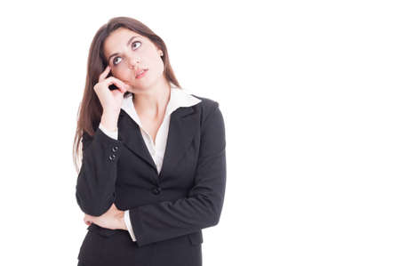 Young business woman thinking and wondering isolated on white backgroundの写真素材