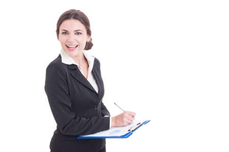 Happy smiling business woman or financial manager holding clipboard and writing isolated on white backgroundの写真素材