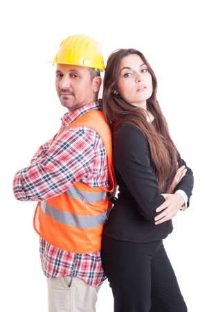 Construction builder and business woman standing confident back to back  as successful partnership and teamwork concept isolated on white backgroundの写真素材