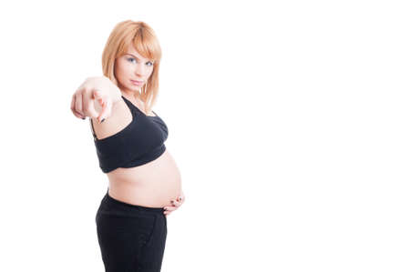 Cute young pregnant girl pointing finger to the camera isolated on white backgroundの写真素材