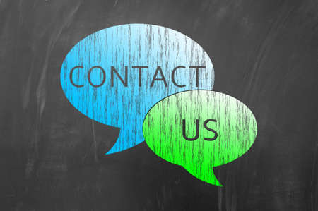 Contact us draw on blackboard or school chalk boardの写真素材