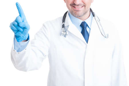 Medic or doctor pressing invisible button on transparent screen concept with white copy spaceの写真素材