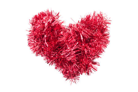 Christmas tinsel or garland heart shape isolated on white backgroundの写真素材