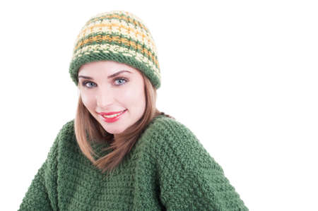 Smiling female model wearing winter fashion clothing isolated on white studio backgroundの写真素材