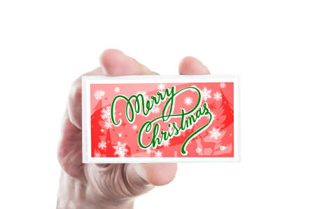 Hand holding red xmas greeting card isolated on white backgroundの写真素材