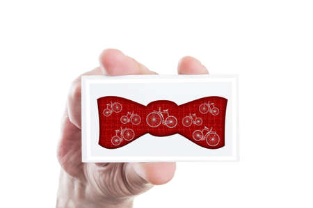 Hipster bowtie concept with vintage retro bicycles shapes on a paper cardの写真素材