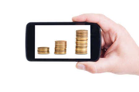 Money piles growing on smartphone screen or cellphone display