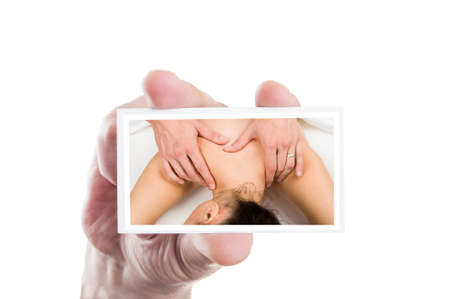 Hand showing picture with relaxed beautiful woman receiving massage