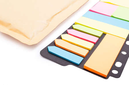 Colorful blank post-it paper in closeup on white background as memo and reminder label concept