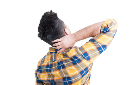 Young male model with pain in his neck as cervical or spine ache concept isolated on whiteの写真素材