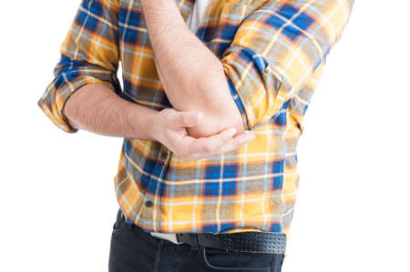 Close-up of young male with pain in injured arm or elbow as illness or ache concept isolated on...