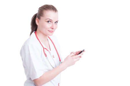 Doctor woman using smartphone and smiling friendly and female contact person concept isolated on...