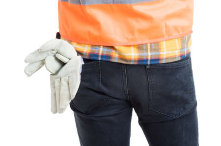 Closeup of young constructor back posing in uniform or equipment as safe workwear concept isolated on whiteの写真素材