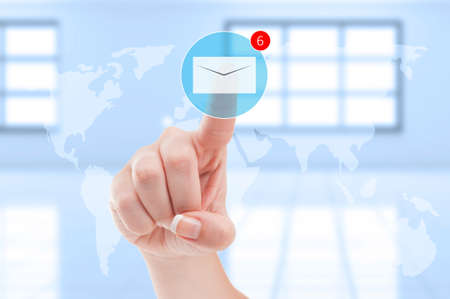 New emails inbox futuristic concept with finger pressing digital envelope on transparent digital...