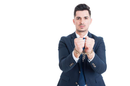 Corruption and bribe concept with politician chained hands with copyspace isolated on white backgroundの写真素材