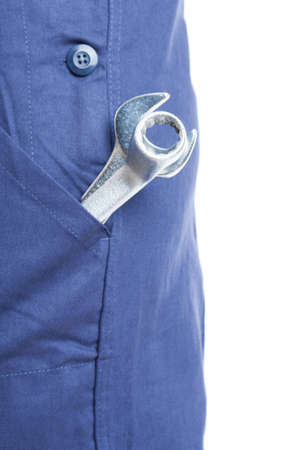 Closeup of mechanic overall pocket with wrenches in the garage isolated on white backgroundの写真素材