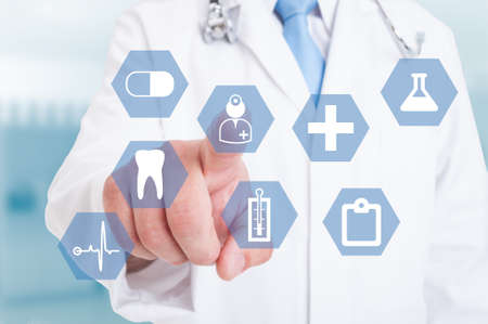 Doctor finger using a touch screen interface with medical icons as modern and virtual medicine